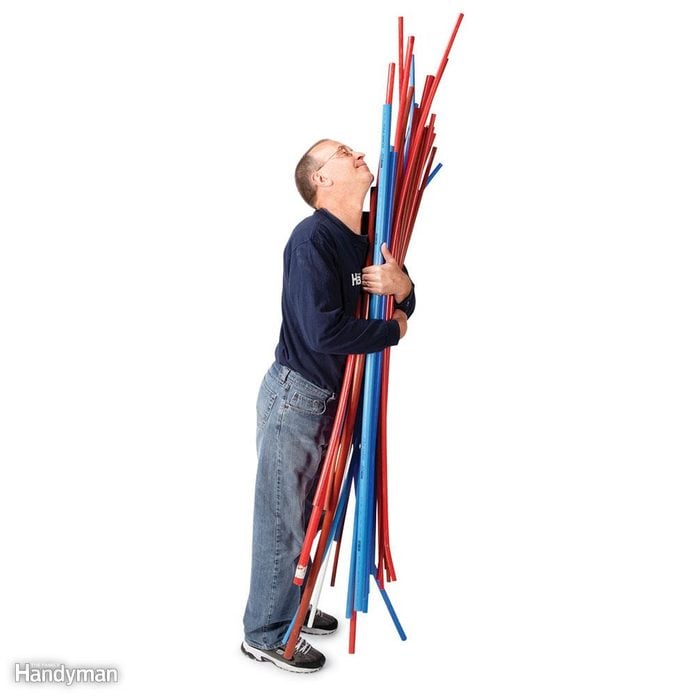 Man holding PEX piping