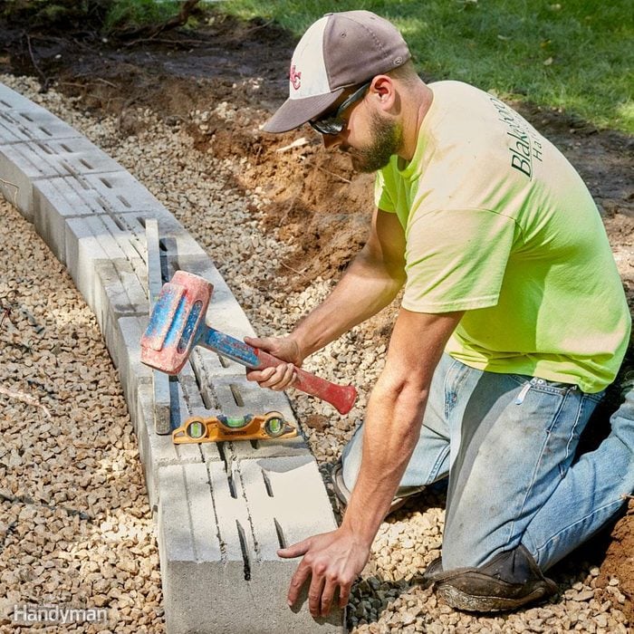 Get the first course of landscape retaining wall blocks right