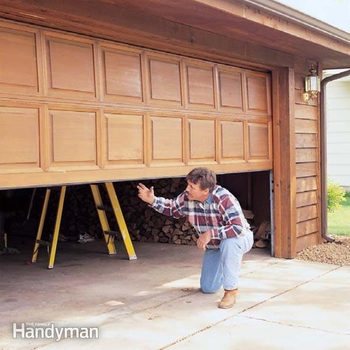 Garage Door Tune Up Diy Family Handyman, Wood Garage Door Bottom Panel Replacement Cost