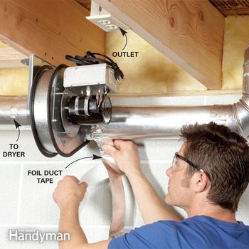 Man installs a dryer duct booster fan