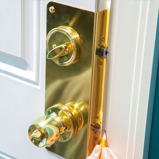 marking a mark near doorknob with pencil, How To Increase Entry Door Security Ft Fh11jau 520 06 039 Ksedit