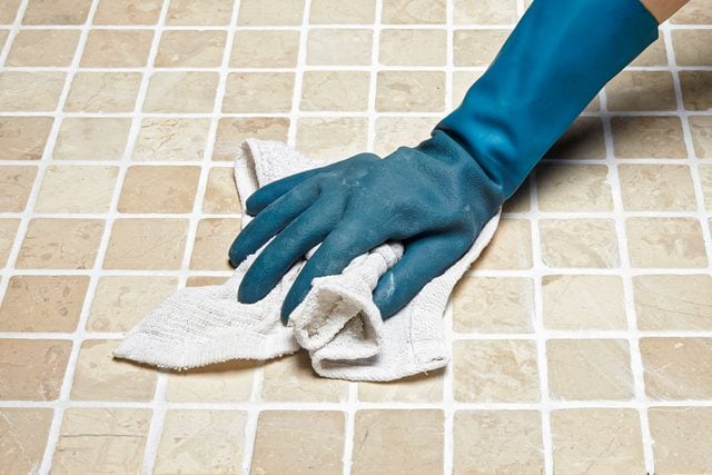 How To Whiten Grimy Grout, Cleaning Tiles with Cloth with Hand wearing Rubber Gloves