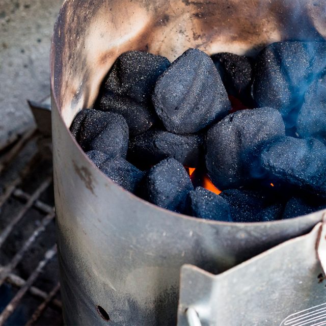 charcoal chimney with close-up of lit coals