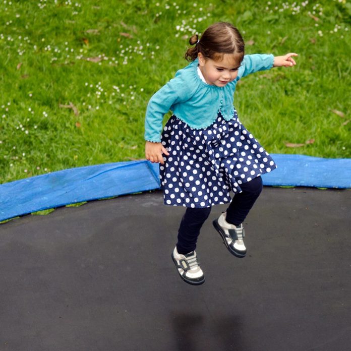 little girl jumping on trampoline safety