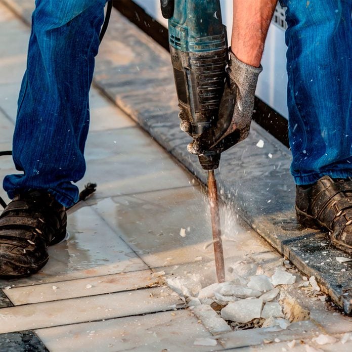 jackhammer removing crushing tile