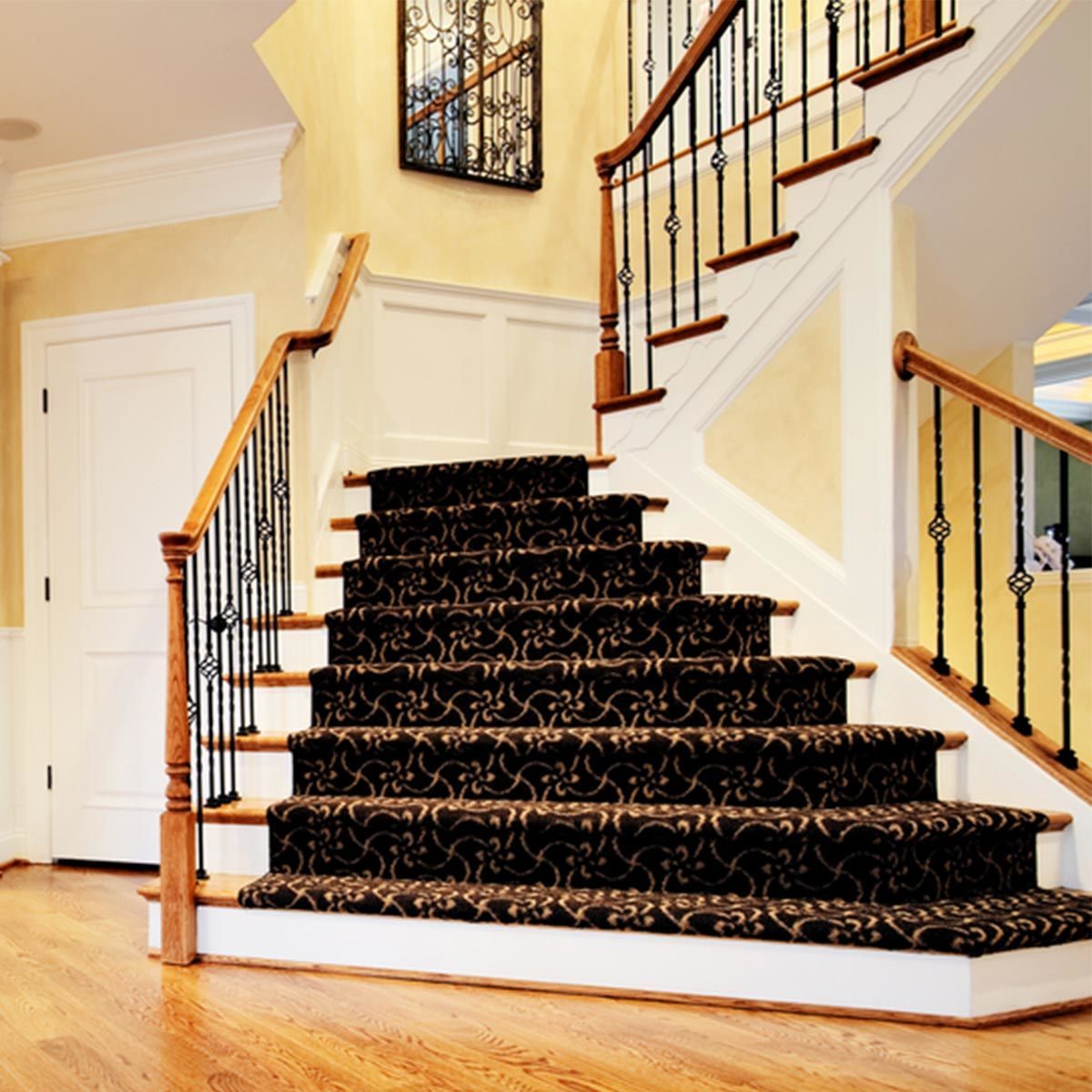 grand entry stairs with carpet