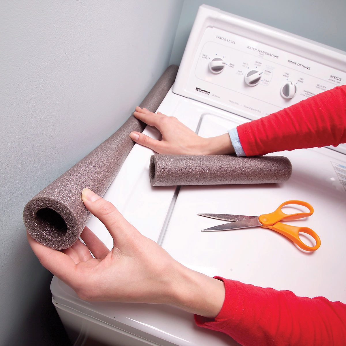 foam pipe insulation next to washing machine laundry room