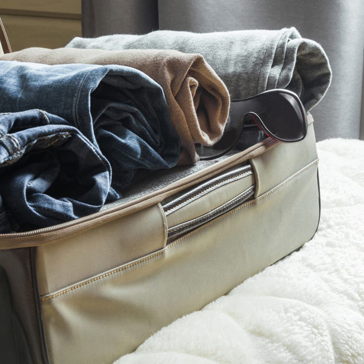 suitcase storage clothes rolled up