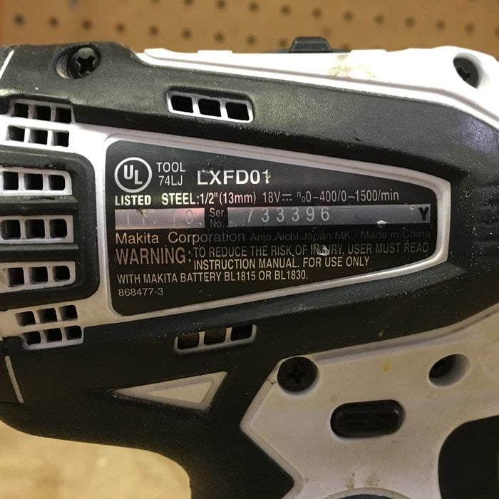 A close up of the serial number on a drill | Construction Pro Tips
