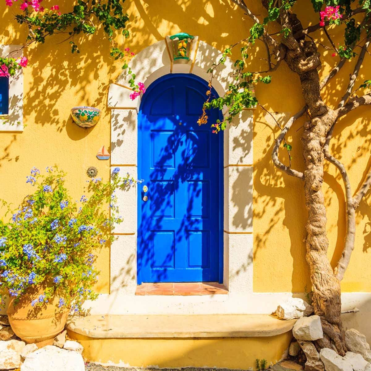 blue door yellow stucco siding Mediterranean home exterior home colors, house exterior colors