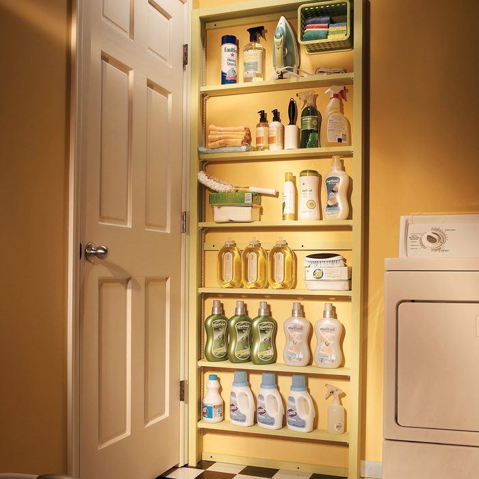 behind the door storage shelves laundry room