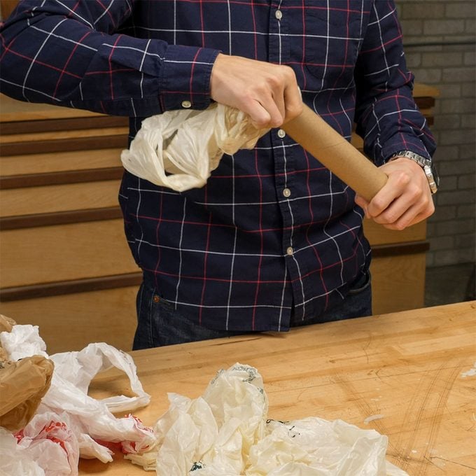 stuffing plastic bags in paper towel roll