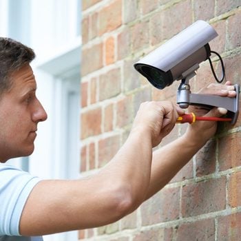 shutterstock_288541091 installing wifi security camera outdoors exterior