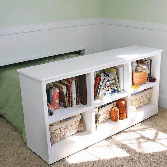 Hidden bed behind bookshelf