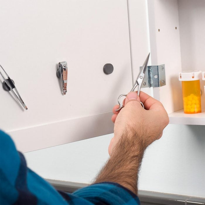 mount magnets inside a medicine cabinet