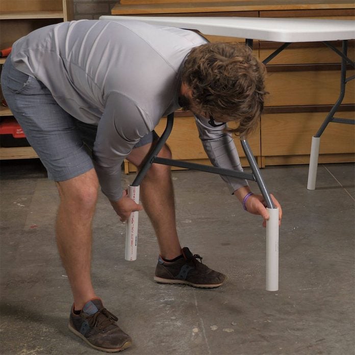 adding pvc to table legs to make a taller table