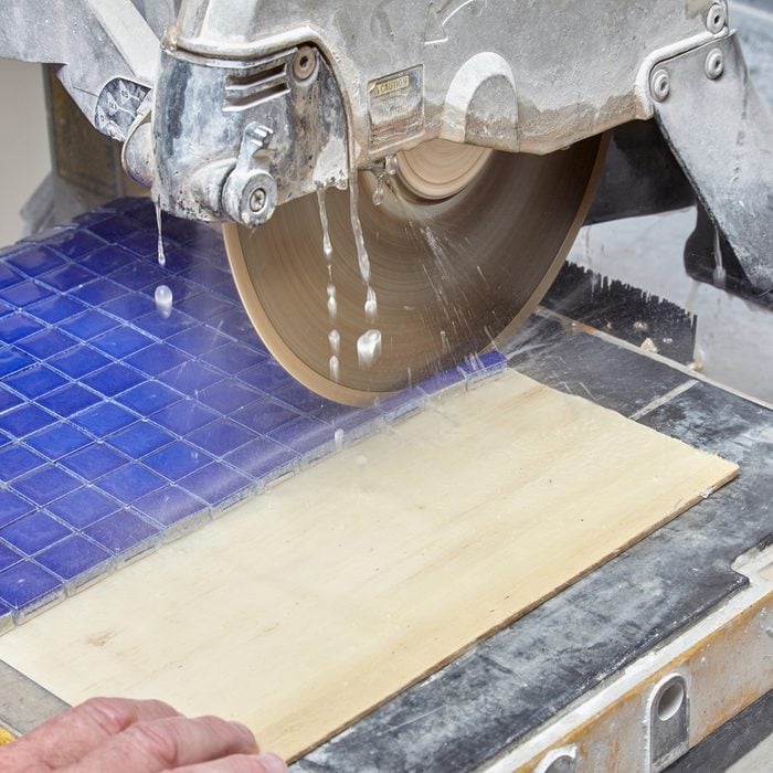 cutting tile on a cutter | Construction Pro Tip