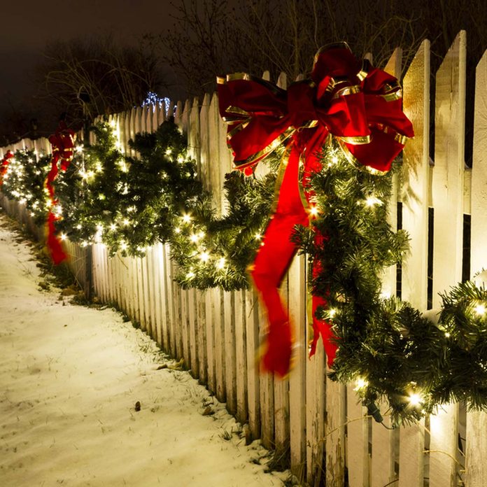 durable_131642774_04 christmas lights on white picket fence