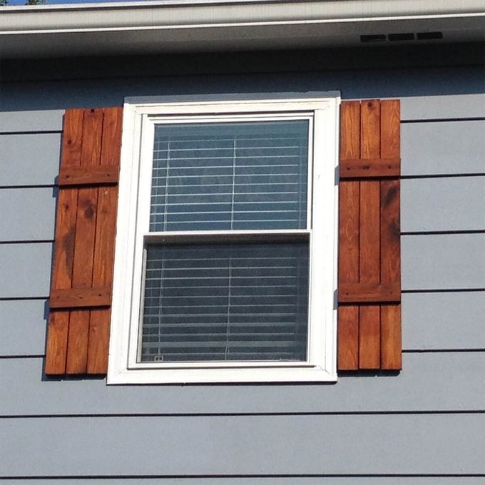 DIY stained shutters on window