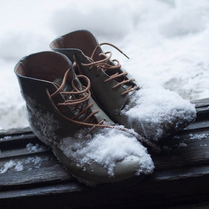snow boots in the entryway of home