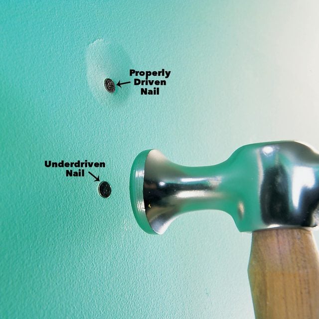 Tap nails slightly below the drywall face