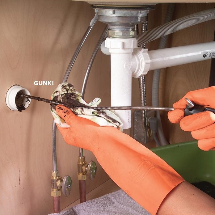 remove the snake clogged drain gunk