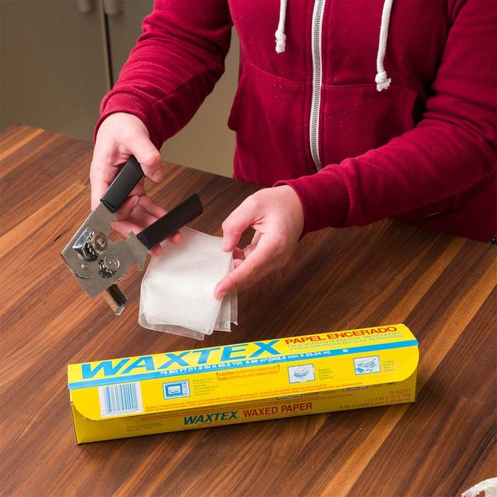 clean can opener with wax paper