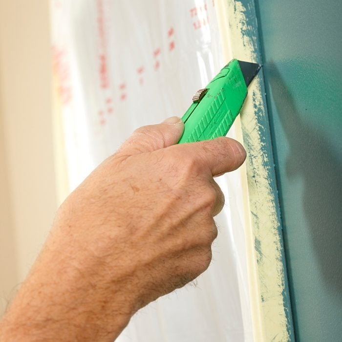 Cut the tape before pulling from the wall to prevent tearing | Construction Pro Tips