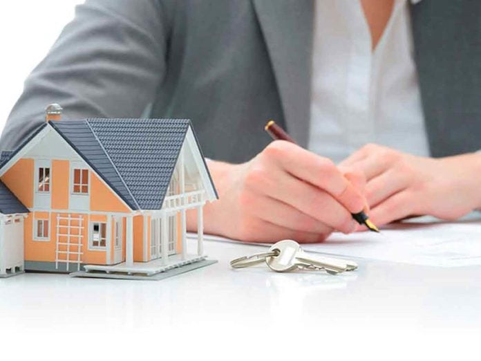 Woman signs purchase agreement for a house