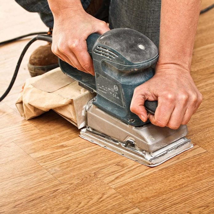 dfh9_shutterstock_76877482 sanding down wood floor scratches and imperfections refinishing