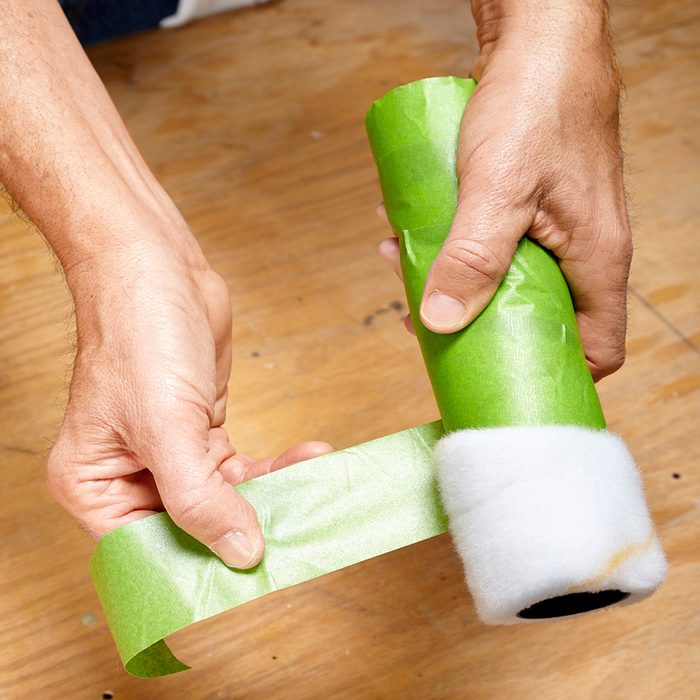 Remove the fuzz from a roller with masking tape | Construction Pro Tips