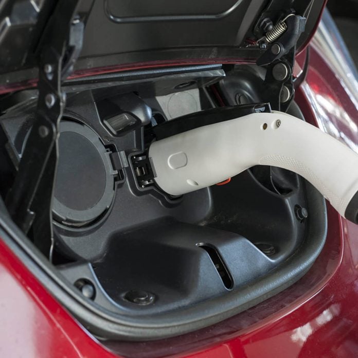 shutterstock_395339038 charging hybrid electric car