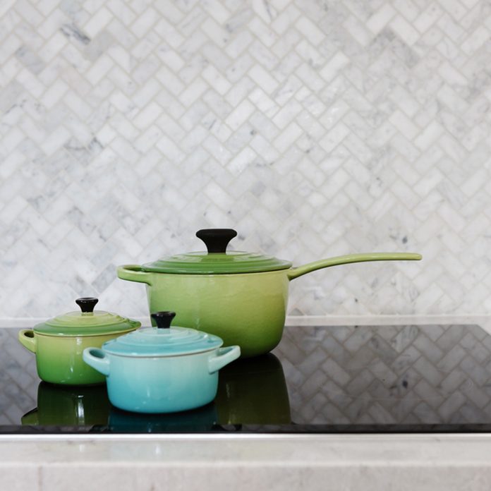 shutterstock_758302198 grey tile kitchen backsplash pots 