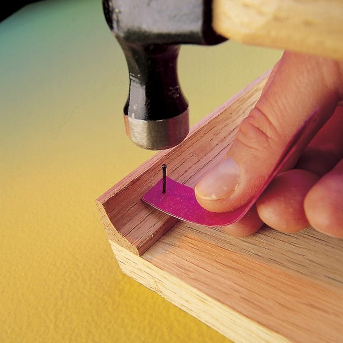nail holder with hammer