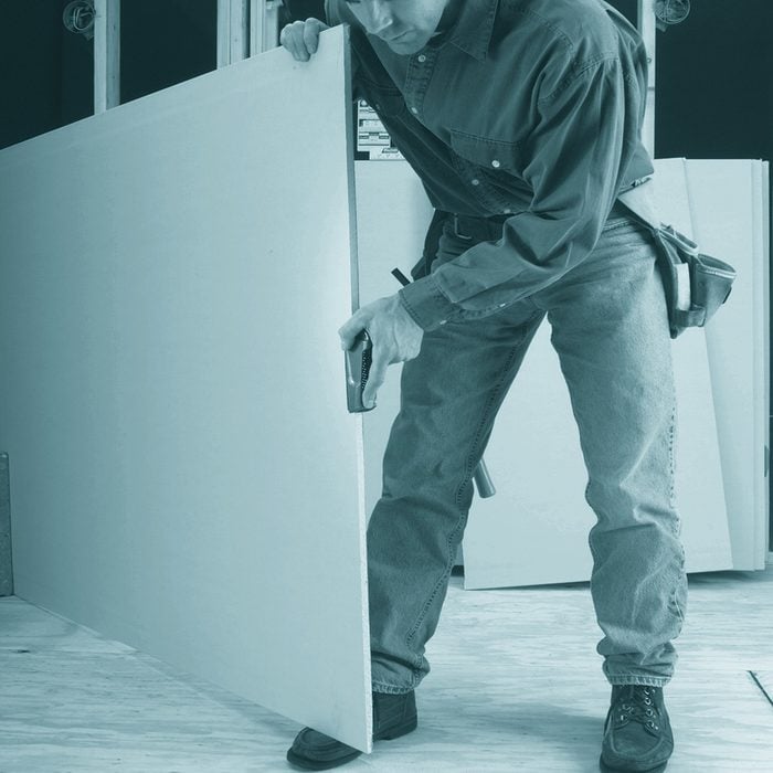 A Man Planing Drywall | Construction Pro Tips
