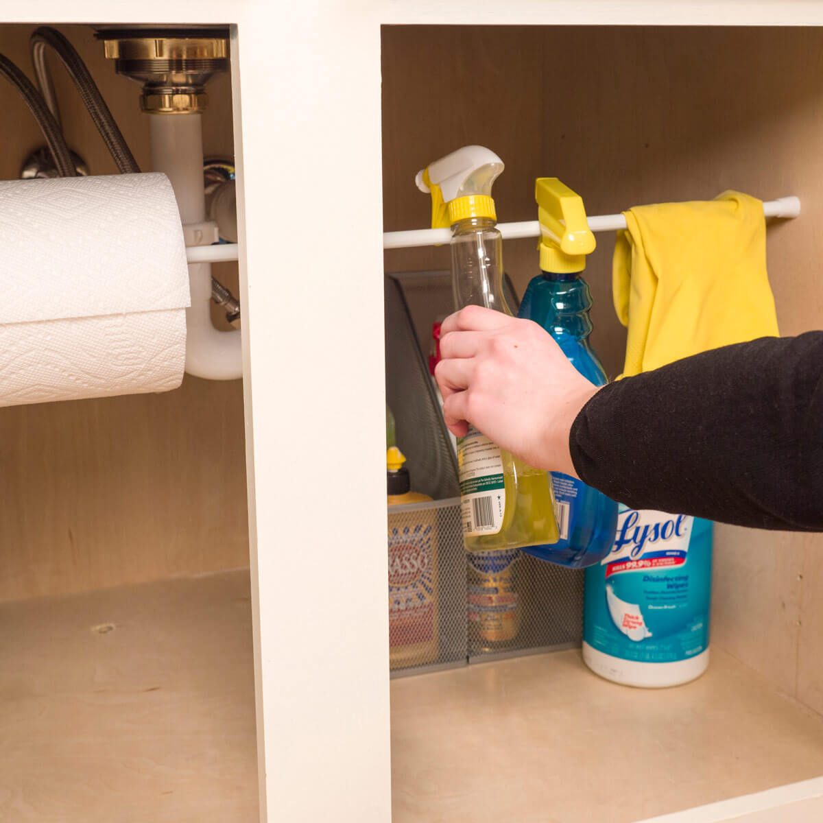 laundry room ideas Tension rod organize under sink