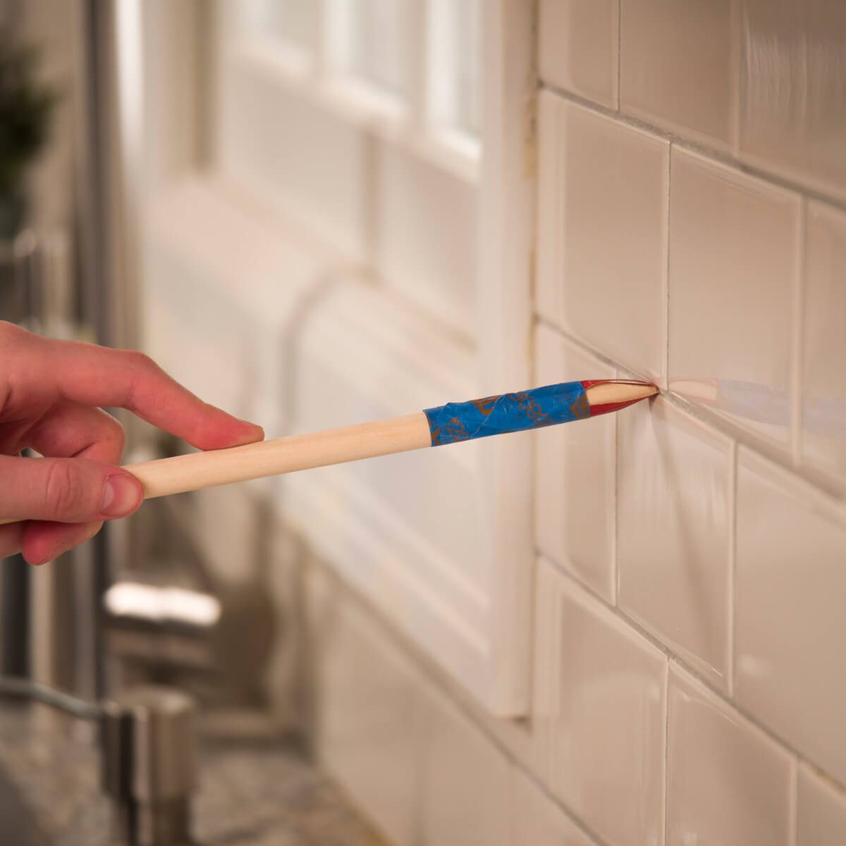 HH Clean tile grout with sandpaper dowel