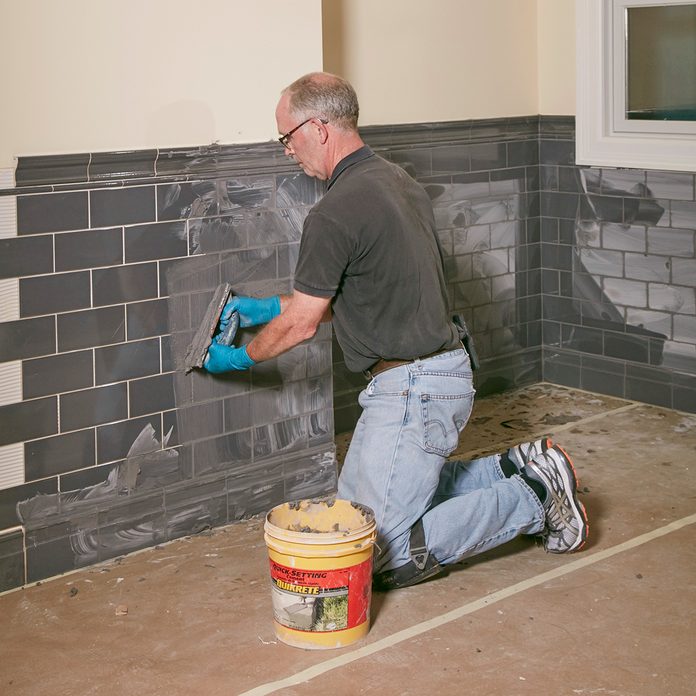 Grout the tile