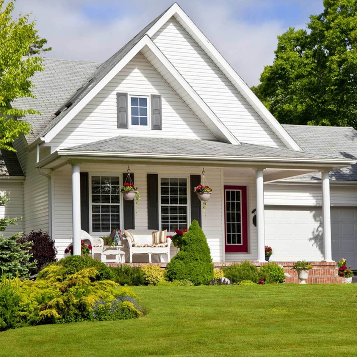 white house with front porch exterior landscaping 