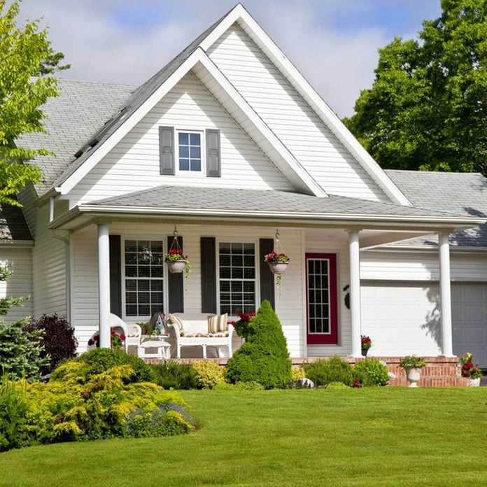 white house with front porch exterior landscaping