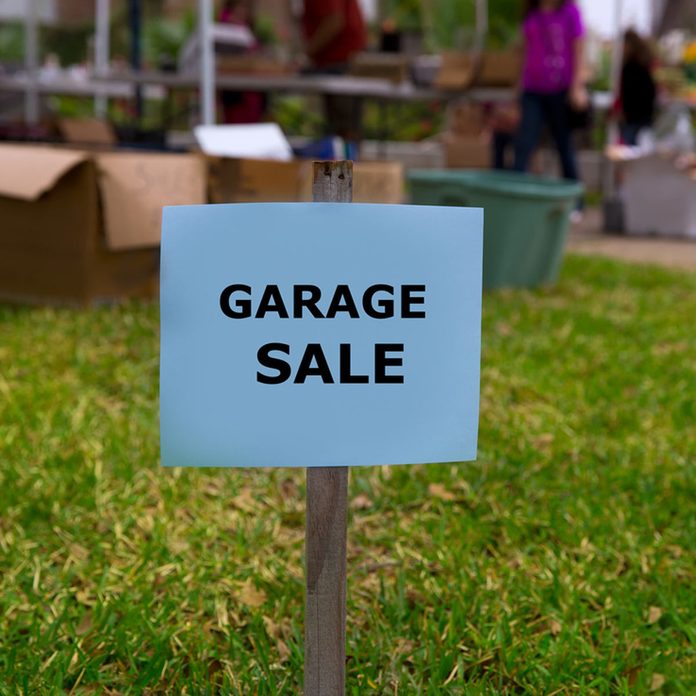 garage sale sign in yard