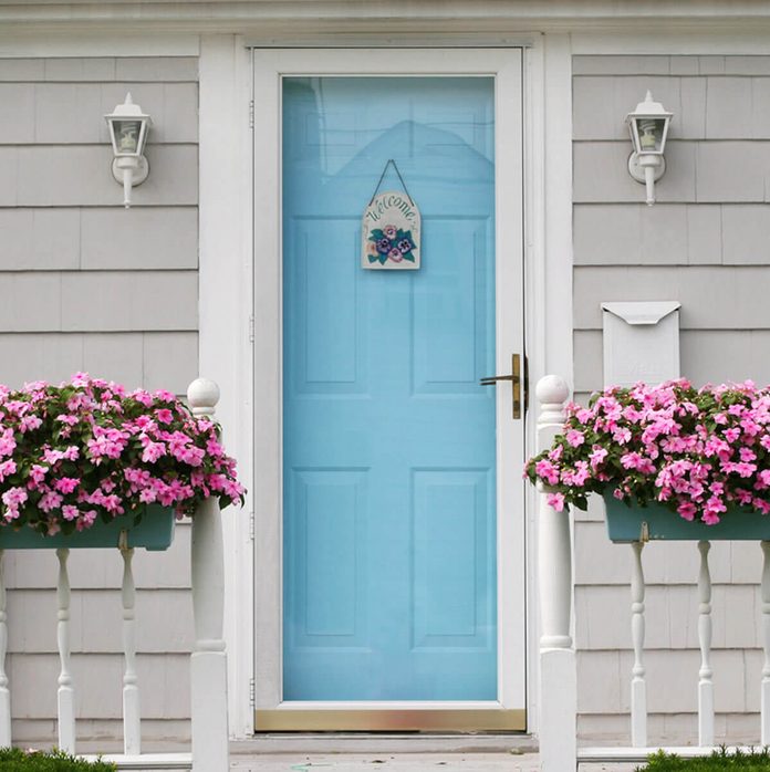 Light Blue Front Door with Planter Boxes