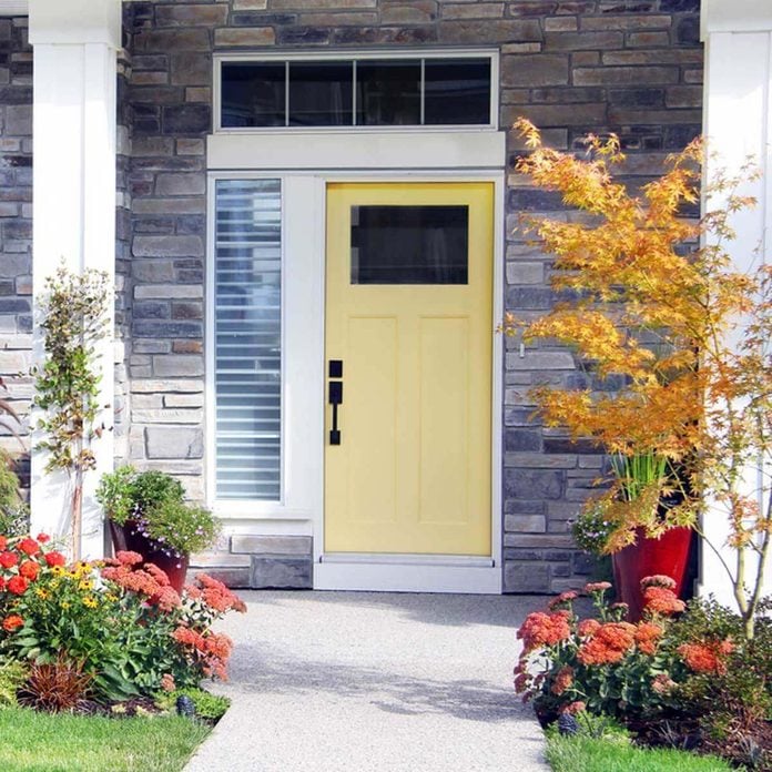 Yellow Front Door with Landscaping
