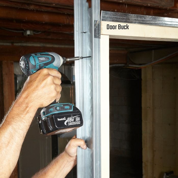 Using wood bucks to create a form for the door | Construction Pro Tips