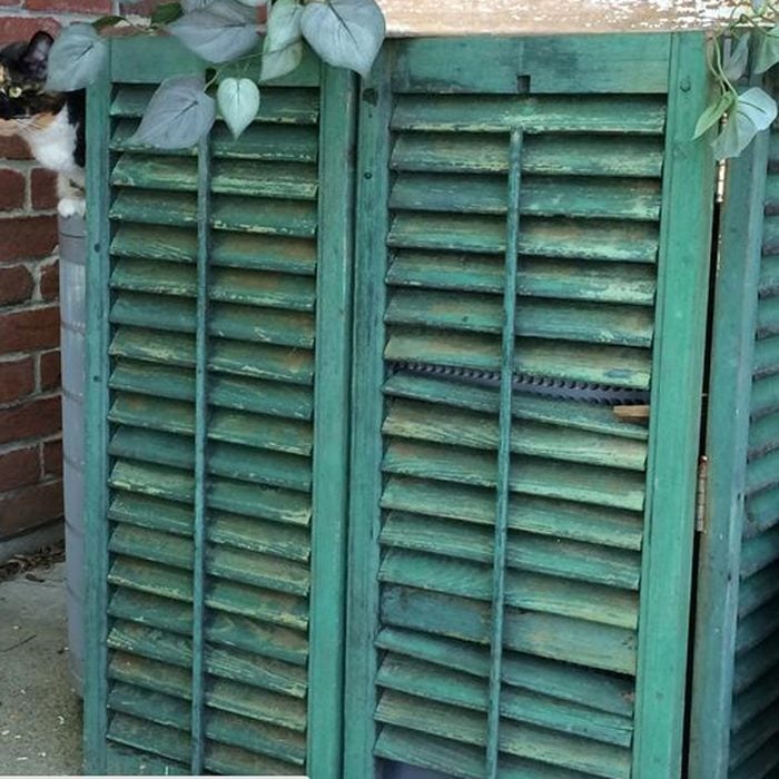 Hide AC Unit with a Shabby Chic Shutter Screen