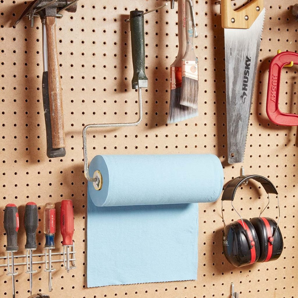 paint roller paper towel holder on peg board with other tools
