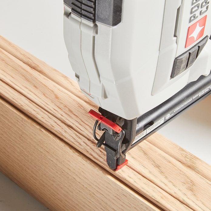 The tip of a brad nailer | Construction Pro Tips