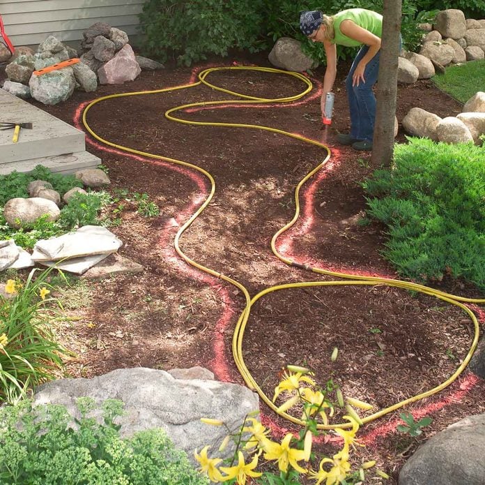 mark hole with hose and paint digging pond