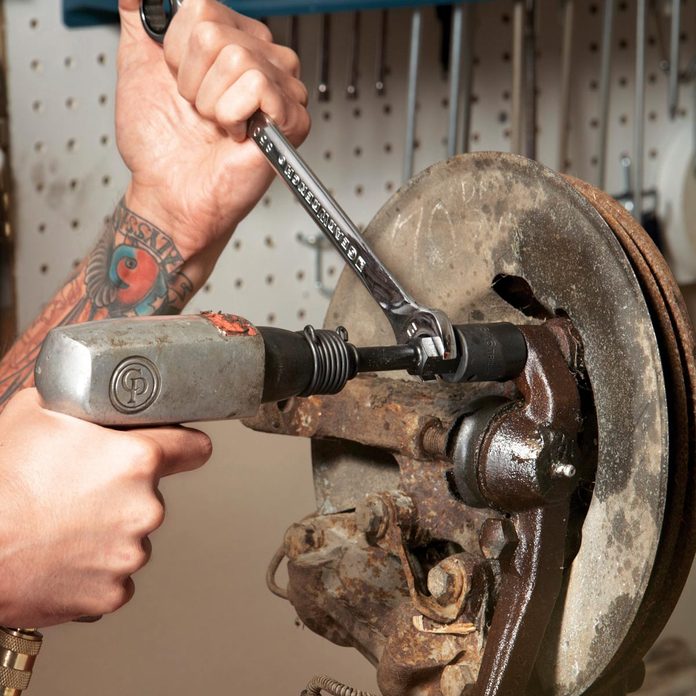 loosen stuck bolts with a socket and air hammer