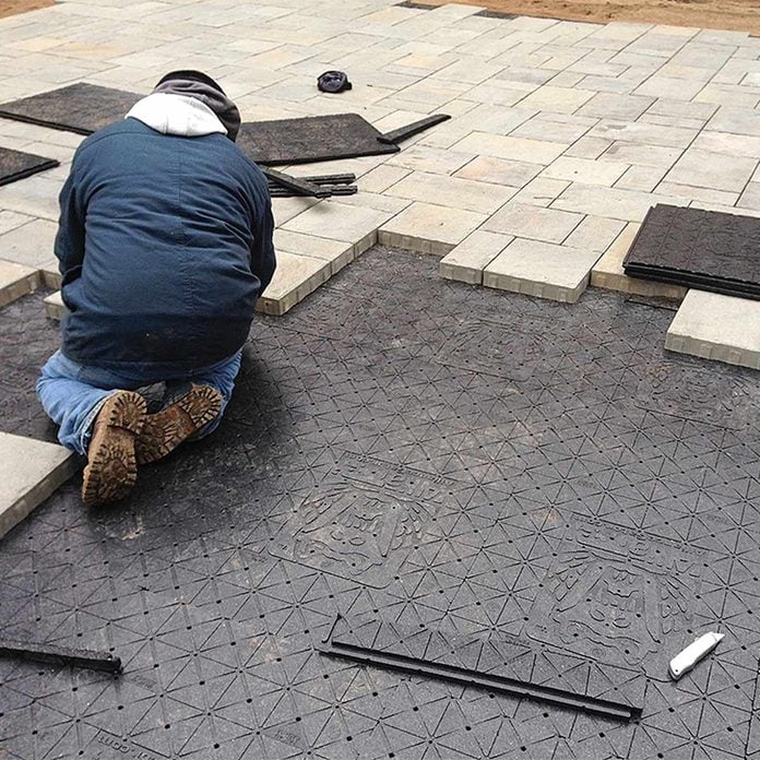 install pavers over panels patio